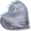 A clear crystal piece in the shape of a heart. The crystal heart is leaning on it's side and it has a quote from Robert Frost & a loving message engraved on it. It's 4.25" x 4.25" in size & weighs 1.9 lbs.