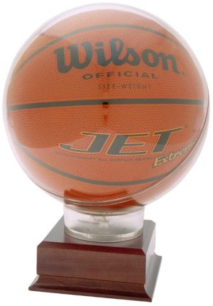 A basketball display case that features an acrylic top that holds a men's size basketball. It's mounted on a wood base that includes an engraving plate for personalization.