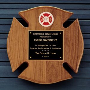 Our Firefighter Maltese Cross Plaque features a solid walnut Maltese Cross that measures 10" x 10" in size. At the top is a Maltese Firefighter Symbol with a hook & ladder on the left and a fire hydrant on the right. The middle area features a black & gold engraving plate for personalization.