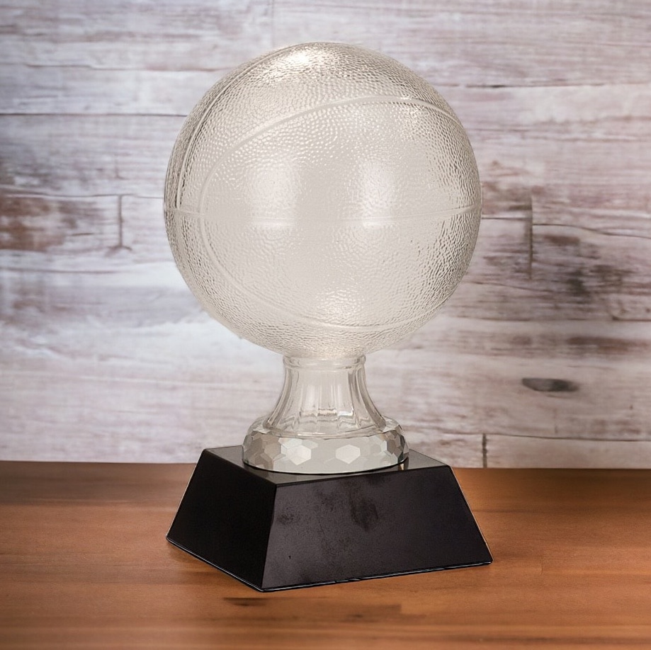 A frosted glass basketball on a glass stem that is mounted on a black glass base that includes an engraving plate for personalization.