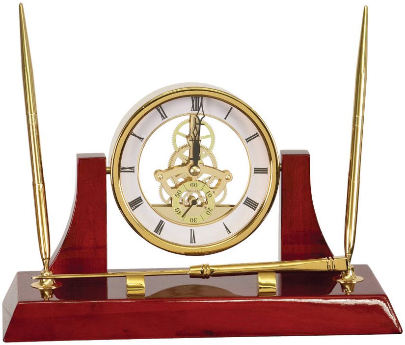 Our Executive Gold Clock Desk Set is made with a glossy piano finish rosewood & gold accents. It includes 2 gold pens, a gold letter opener & a skeleton clock.