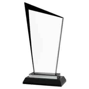 A glass award with a pointed peak on the left top. It also has black accents around the edges. It's mounted on a black glass base that has multiple tiers.