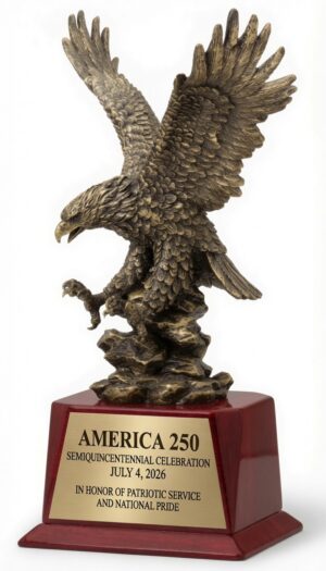 American Eagle Statue (AE380) featuring a large, highly detailed electroplated resin eagle in a dramatic soaring pose with wings fully outstretched and intricate feather detailing, finished in antique bronze. The eagle is mounted on a polished piano-finish rosewood base with a full-width gold engraving plate that reads: 'AMERICA 250 / SEMIQUINCENTENNIAL CELEBRATION / JULY 4, 2026 / IN HONOR OF PATRIOTIC SERVICE AND NATIONAL PRIDE'. This impressive 6″ x 17″ (12 lbs) patriotic trophy symbolizes freedom, strength, and American pride.