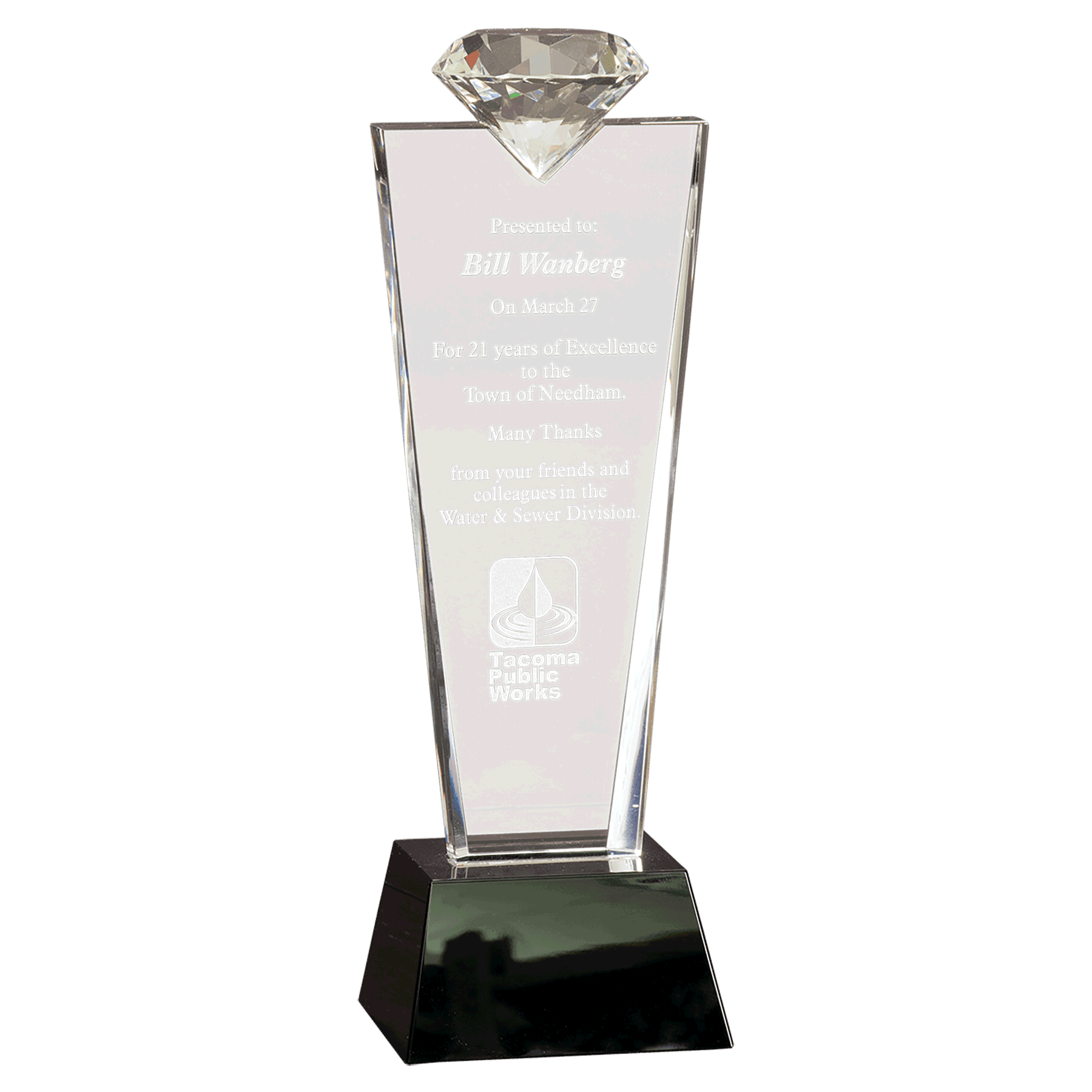 Our Crystal Diamond Top Trophy has a diamond on the top of the trophy and a large engraving area for personalization. The CRY3211C is mounted on a black base and comes in a satin lined deluxe gift box.