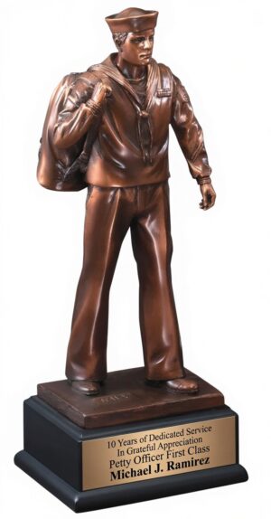 Navy Sailor Statue RFB132 - Detailed bronze-finished electroplated resin figure of a United States Navy sailor in classic dress uniform, carrying a seabag and wearing a traditional white hat. Mounted on a black base with a bronze engraving plate that reads: "10 Years of Dedicated Service / In Grateful Appreciation / Petty Officer First Class Michael J. Ramirez". This personalized military recognition trophy honors 10 years of naval service. Perfect for retirements and veteran appreciation gifts.