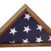 A flag display case made from genuine walnut wood and coated in a glossy piano finish. It's made in the shape of a triangle. The middle of the case shows the blue of the flag & white stars of the American flag behind a glass cover..