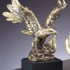 Gold eagle statue with a gold American flag, mounted on black base, AE700 is 7.5", AE710 is 11", AE720 is 14.5"