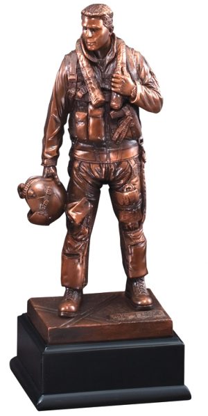 A bronze statue of an Air Force airman in full gear with his helmet in hand. The bronze statue is mounted on black base.