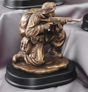 Solider shooting military statue shows soldier aiming gun mounted on black base, MIL203 is 5" x 9" Size, Weighs 4.75lbs.