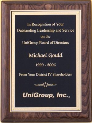 An award plaque featuring a piano finished walnut board. The black engraving plate features a gold Florentine Board. The engraving plate has gold engraving of recognition text & company logo.