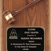 A large American walnut board that is 11x15 in size. It features a walnut gavel at the top and a black engraving plate at the bottom. The engraving plate has words of recognition for the President of Illinois State Chapter of the Arthritis Foundation.