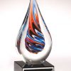 Glass teardrop with blue, orange & black colors inside, Mounted on black glass base, 1625 is 7.5" tall, Weighs 3.65 lbs.