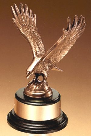 Antique bronze casted eagle statue on round black base with gold engraving plate, 1295/XL is 9" tall, weighs 4 lbs.