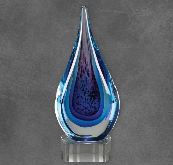 Glass Raindrop with multiple blue colors throughout, mounted on clear glass base,