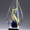 Pointed spire piece of glass with streaks of color throughout, Mounted on clear glass base, 2261, 7.25" tall