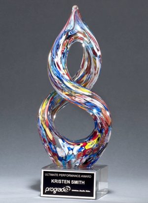 Helix shaped piece of glass with many colors throughout, Mounted on clear glass base with engraving plate, 2270, 10" tall