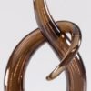 Brown hook shaped piece of contemporary art glass, mounted on a black glass base, GLSC54, GLSC55