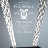 A glass award made in the shape of a hand fan with a stainless steel diamond cut design on the sides. The inside features laser engraving for the Star Performater of the Crescendo Orchestra. That clear glass piece is mounted on a black glass base.