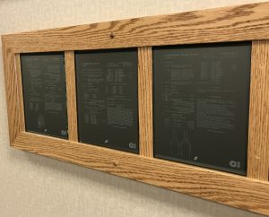 A display for patents that have been laser engraved into glass plaques. They're located at the corporate headquarters for Owens-Illinois.