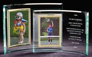 2 glass crescent picture frames with gold metal frames where the photo goes. On the right side of the glass crescent is where laser engraved text is for a loving message or verbiage commemorating a special occasion. The smaller size fits a 4x6 photo, while the larger size holds a 5x7 photo.