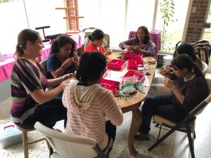Women from El Refugio in Guatemala creating jewelry that can later be sold. The profits will go to their care, rehabilitation and help them get back on their feet.