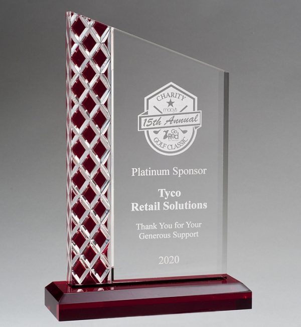 Our Red Zenith Acrylic Award features a piece of acrylic with a red lattice pattern on the left & a clear area for personalization on the right. It's mounted on a red acrylic base for stability.