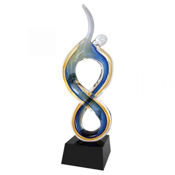 Contemporary person made from art glass with blue & yellow colors, mounted on black base, AGS35 is 17" tall, Weighs 6.6 lbs.