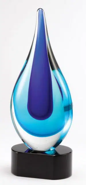 Glass rain drop with two shades of blue mounted on a black glass base.