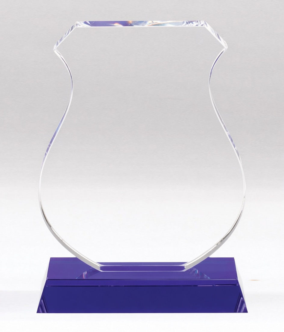 Elegant clear crystal trophy shaped like a police badge with a graceful curved shield design and vibrant purple accents on the base. Perfect for law enforcement recognition, years of service awards, retirement gifts, and distinguished officer honors.