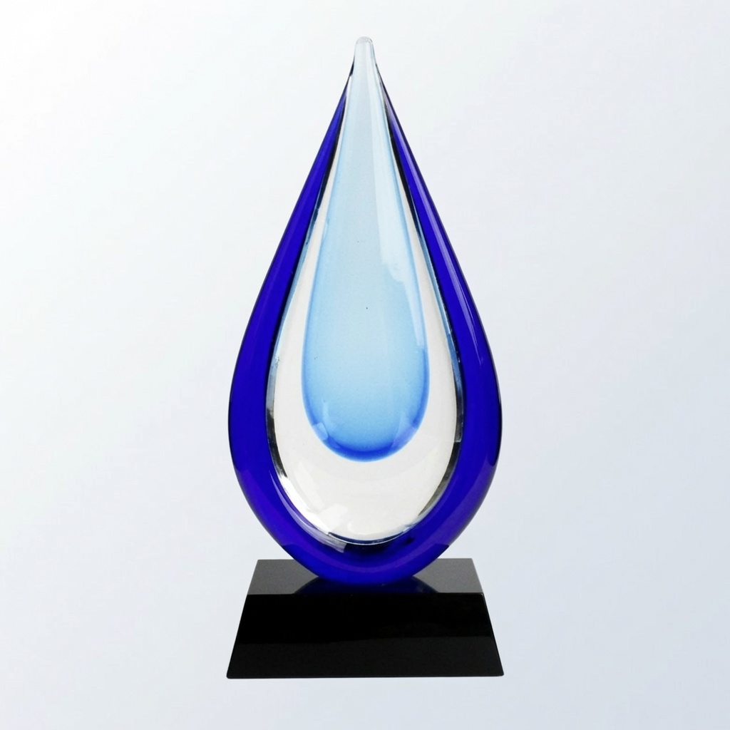 Striking teardrop-shaped hand-blown crystal glass trophy with vibrant cobalt blue outer edges and a glowing light blue center. Mounted on a sleek black base, this elegant modern award is perfect for achievement recognition, corporate gifts, and artistic presentations.