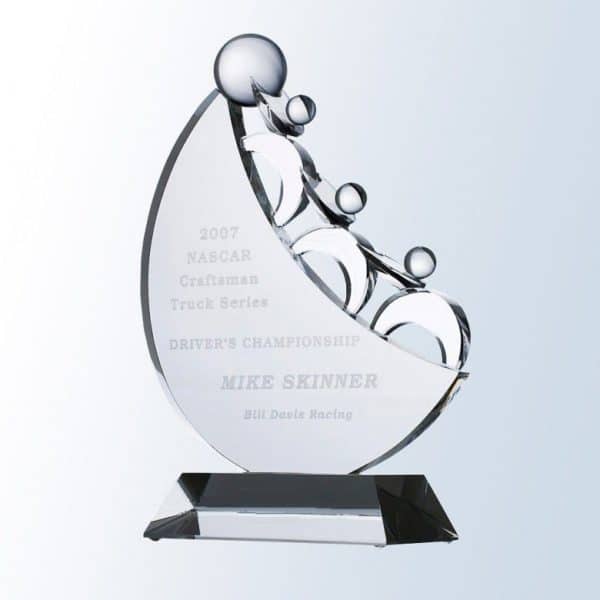 A crystal award featuring 3 crystal people pushing a ball up the hill while working together. It's mounted on a clear crystal base with a middle area for personalization.