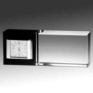 A horizontal crystal clock that sits on a desk. The left 1/3rd is black crystal with a white faced clock & silver works inside the crystal. The right 2/3rds is clear crystal that is blank, but is there for laser engraving personalization.