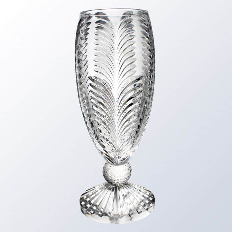 A stunning golf themed crystal vase that's made with 24% Italian lead crystal. The top features a palm branch designs. The connecting piece to the base is a solid crystal golf ball for added design.