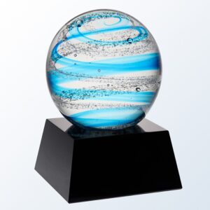 A blue snow globe featuring a solid, round piece of glass with swirling blues & bubbles throughout. It's mounted on a black glass base with an engraving plate for personalization. It stands 5.5" tall, weighs a hefty 6 lbs, comes ina deluxe gift box & includes free engraving.