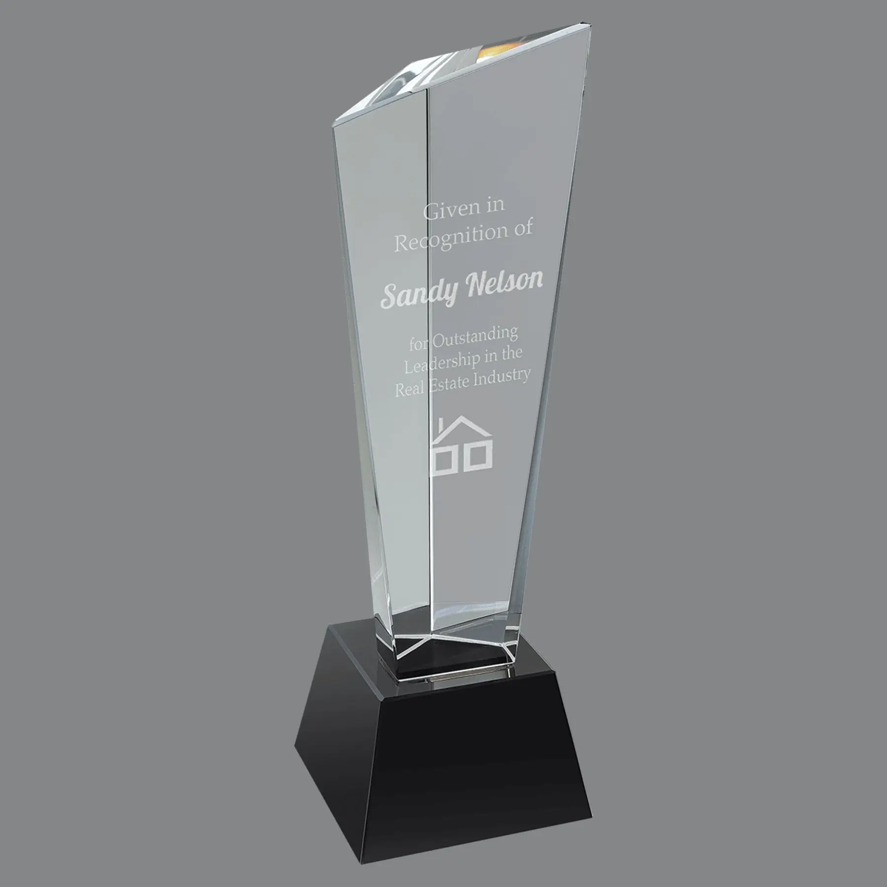 Our Rising Peak Crystal Award CRY23010M is the smaller size of this award. It's 10" tall, weighs 4.3 lbs & comes in a deluxe gift box. It features a tall crystal piece with three points, one higher than the other two, thus giving the rising peak look. It's mounted on a black crystal base.