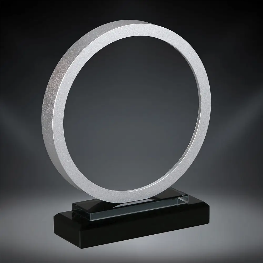 Our Silver Stargate Glass Award features a 6" glass circle. The middle area is for laser engraving personalization, while the outside has a silver anodized accent. It's mounted on a black glass base for stability. This 76227-S is 7" tall, comes in a deluxe gift box & includes free engraving.