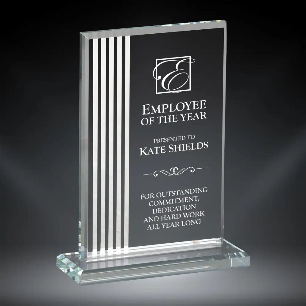 Our Contour Rectangle Glass Award features a rectangle piece of glass with white contour lines on the left and an area on the right for laser engraving personalization. The glass rectangle is mounted on a matching base for added stability. This specific piece is personalized for Kate Shields for being The Employee of the Year. This award comes in 3 sizes to choose from: 75307 is 7", 75308 is 7.75" & 75309 is 8.5" tall. All sizes are packaged in a satin-lined deluxe gift box.