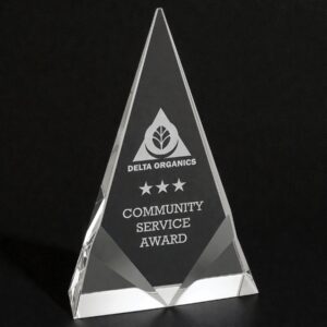 Our Crystal Trophy Award shown here on a black table & a black background as well. The award features a middle area for laser engraving personalization. The bottom corners are accented with decorative front bevels. This is the CRY261M Crystal Triangle that is 5" x 8" in size & weighs 3.0 lbs.