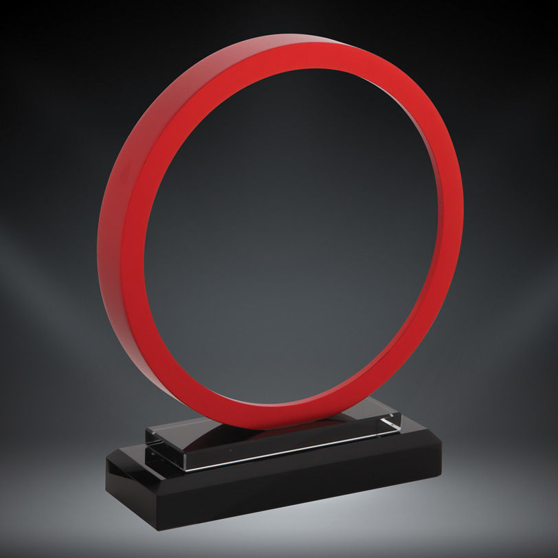 Our Red Stargate Glass Award features a round piece of glass with a red border. The glass circle is mounted on a black glass base. This 76227-R 6" x 7" in size and comes in a deluxe gift box.