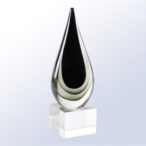 Our Grayscale Raindrop Art Glass Award features a raindrop piece of glass with a black middle area and several gray colors surrounding it. It's mounted on a clear glass base that includes an engraving plate for personalization, but is not shown in this photo. This G2214 award is 3.5" x 11" in size, is packaged in a deluxe gift box & includes free engraving.