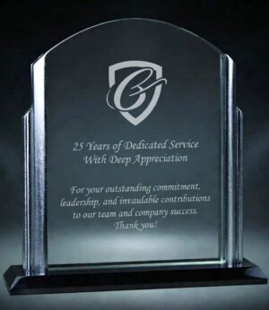 Our Riviera Arch Glass Award shown here with engraving. It features an arched piece of glass for engraving with silver accents on the side and a black glass base. This one is personalized for someone who completed 25 years of service. This glass award is 6.75" x 7.25" in size and comes in a deluxe gift box.
