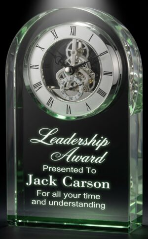 Our Emerald Dome Crystal Clock features a 2.5" thick piece of crystal with a dome at the top & a reflective green mirror base. The top has a silver skeleton clock with black Roman numerals, hands & accents. Below is an area for laser engraving personalization. This CRY951 clock is 5" x 7" in size and weighs 5 lbs.